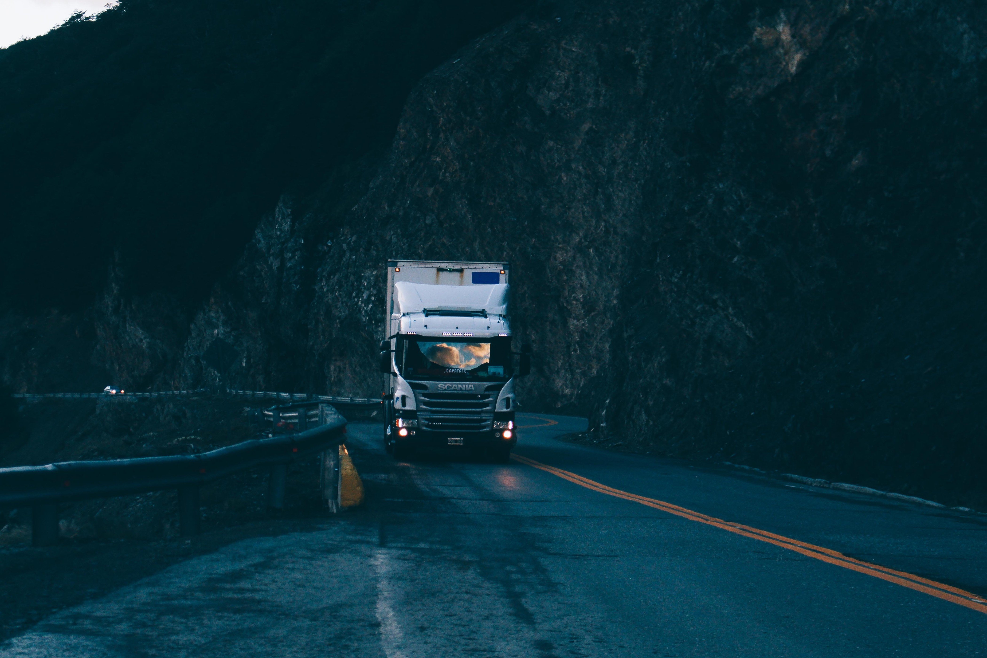 Semi tractor-trailer hauling freight on a mountain highway