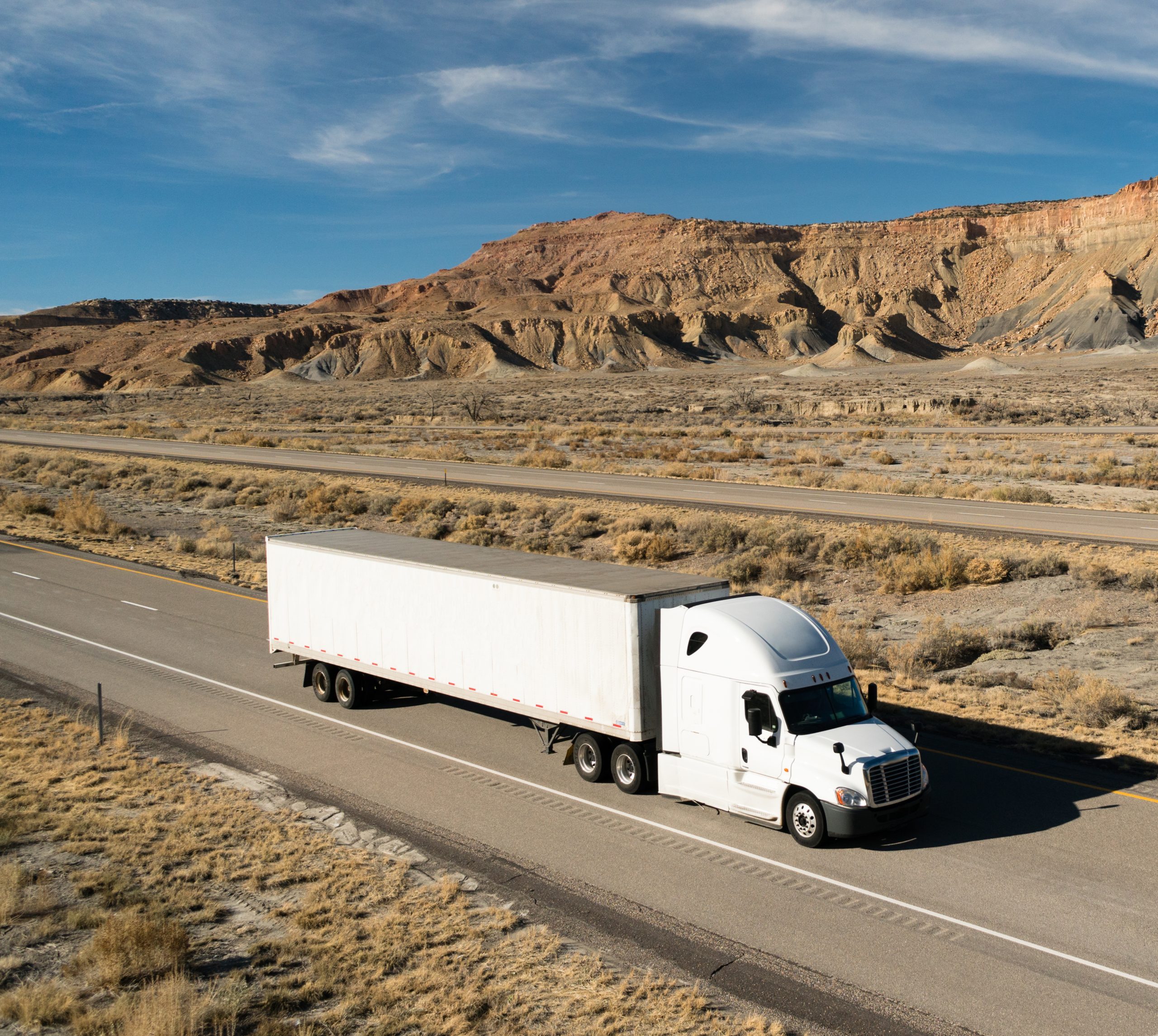Commercial freight truck traveling on an open highway