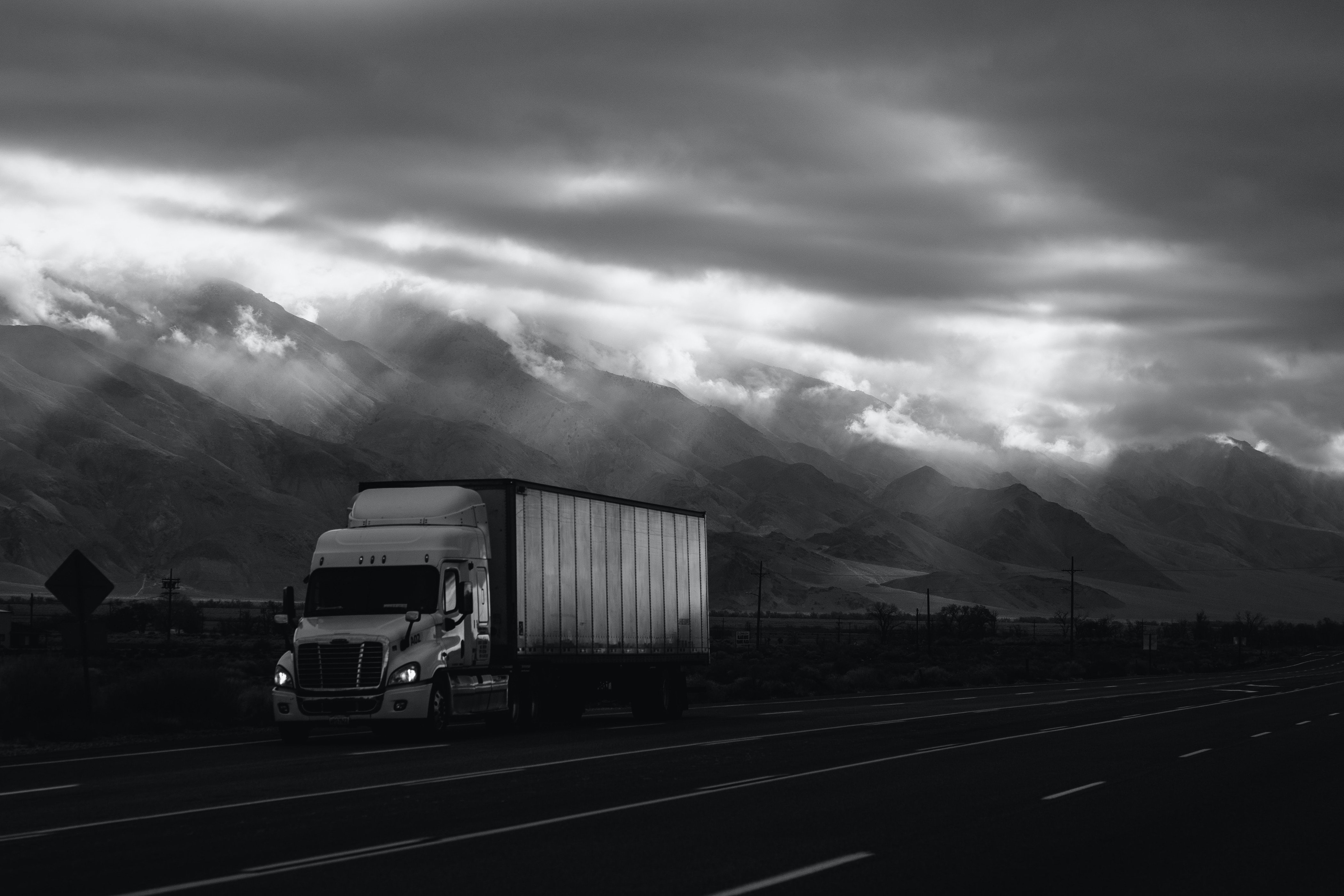 Semi tractor-trailer carrying commercial freight on a mountain highway